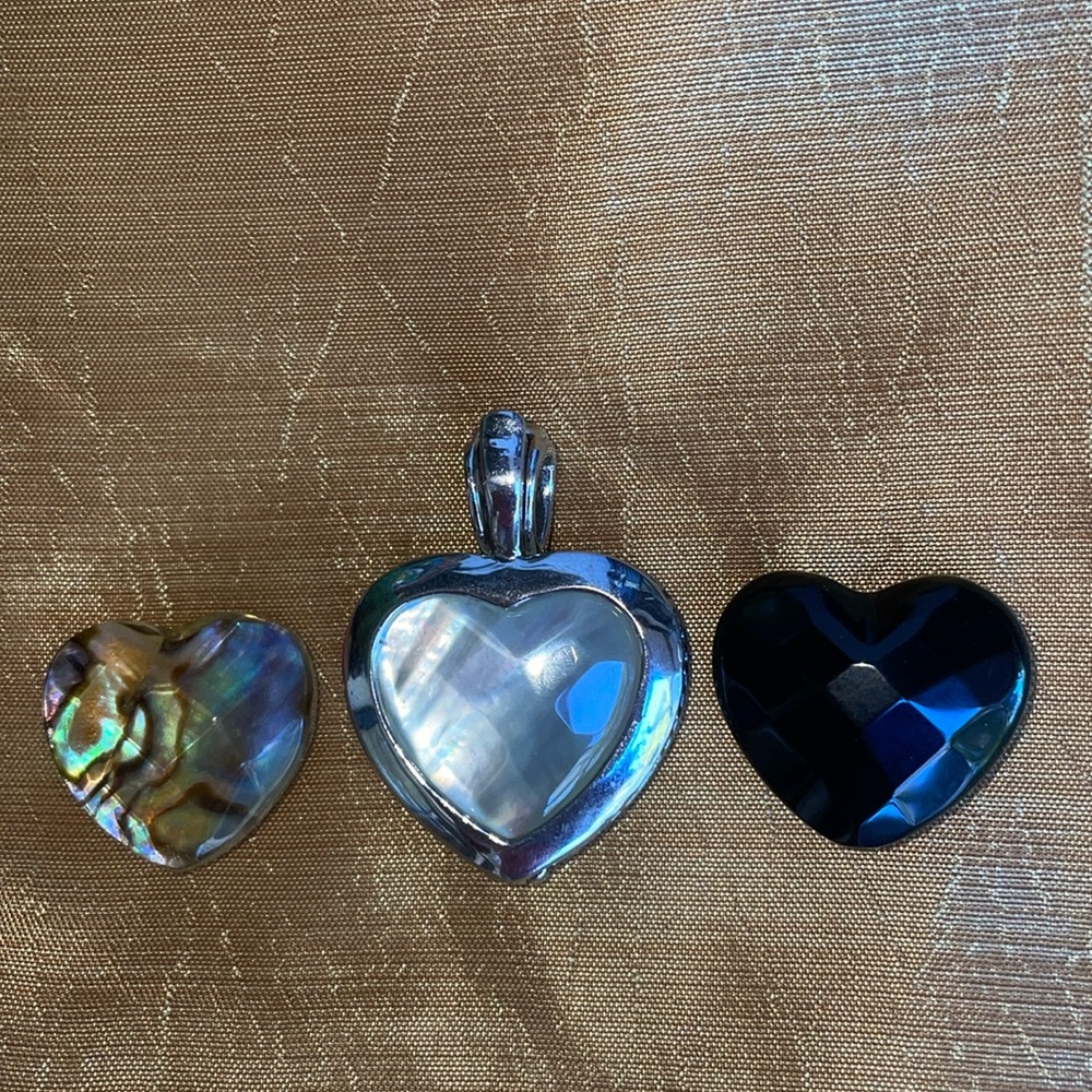 Reversible silver heart pendant with interchangeable semi precious stones.